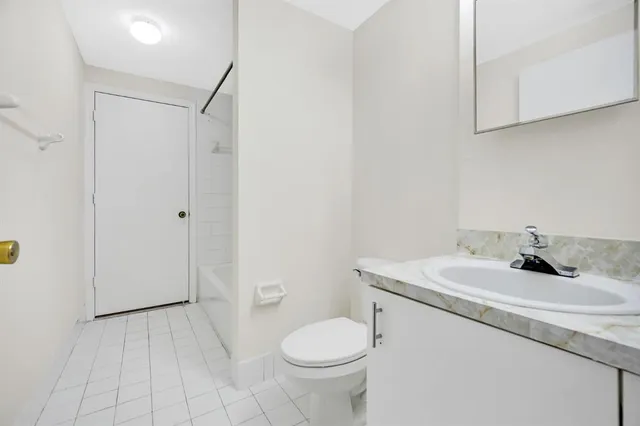 a bathroom with a sink toilet and vanity