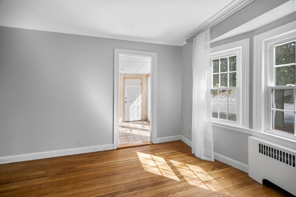 36 Melrose Street Worcester, MA 01605 - Photo 11 of 32 a view of an empty room with wooden floor and a window
