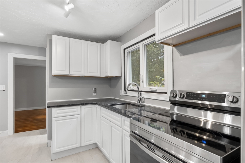 36 Melrose Street Worcester, MA 01605 - Photo 13 of 32 a kitchen that has a sink and a stove
