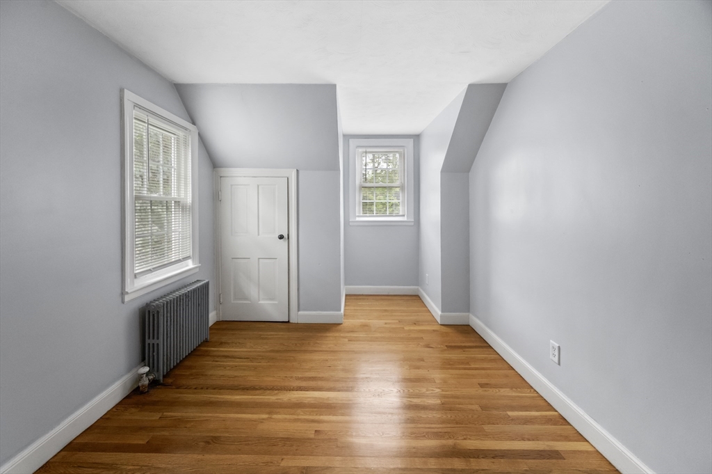 36 Melrose Street Worcester, MA 01605 - Photo 23 of 32 a view of an empty room with wooden floor and a window
