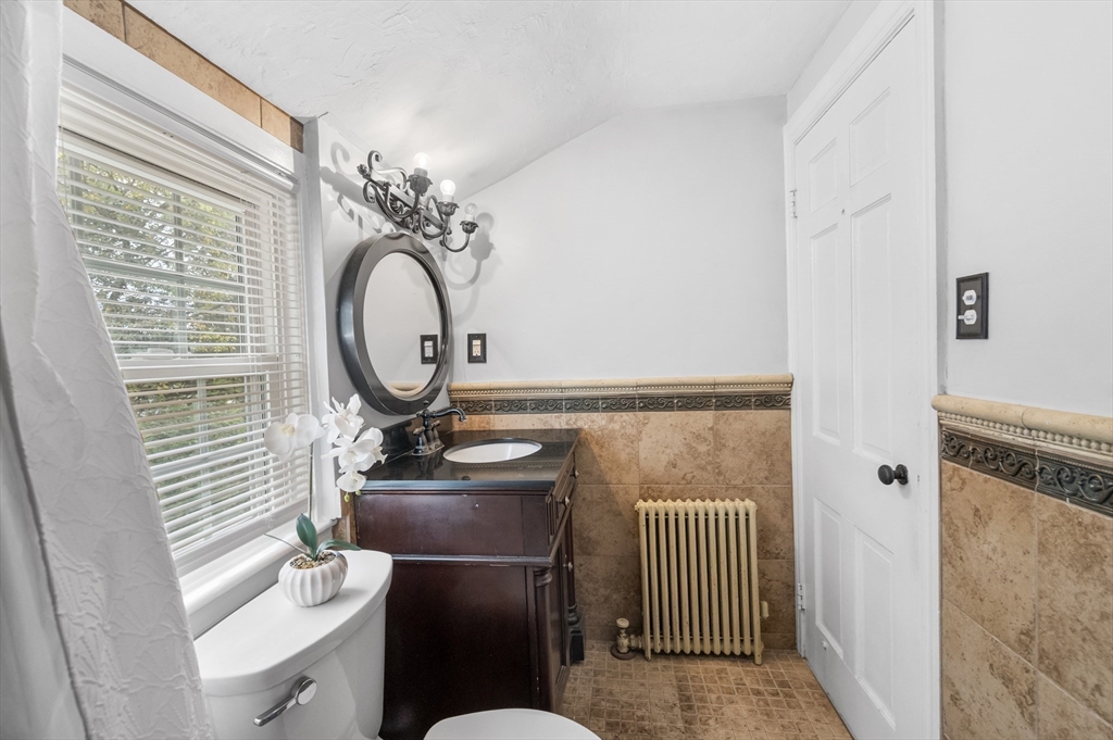 36 Melrose Street Worcester, MA 01605 - Photo 28 of 32 a bathroom with a toilet sink and mirror