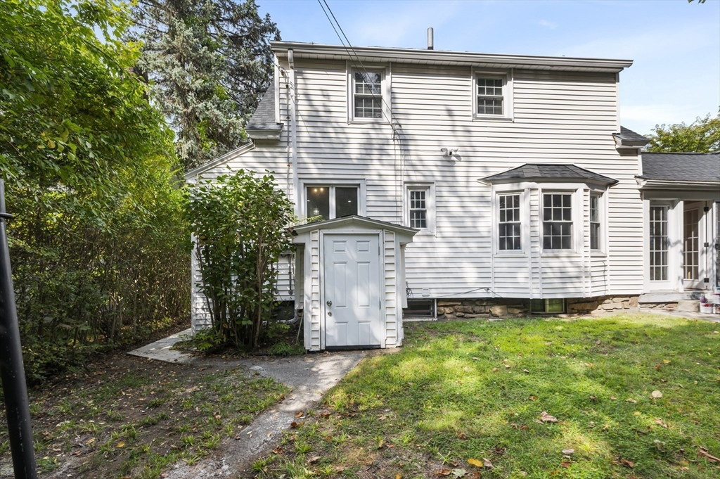 36 Melrose Street Worcester, MA 01605 - Photo 5 of 32 a front view of a house with a yard