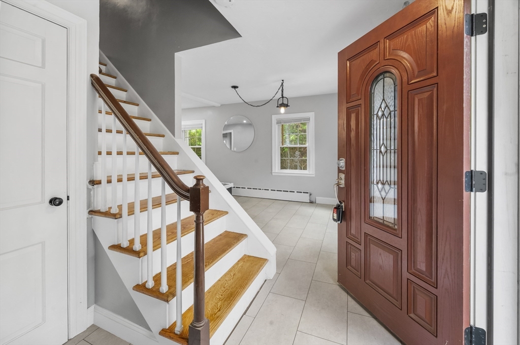 36 Melrose Street Worcester, MA 01605 - Photo 7 of 32 a view of front door with hallway and wooden door