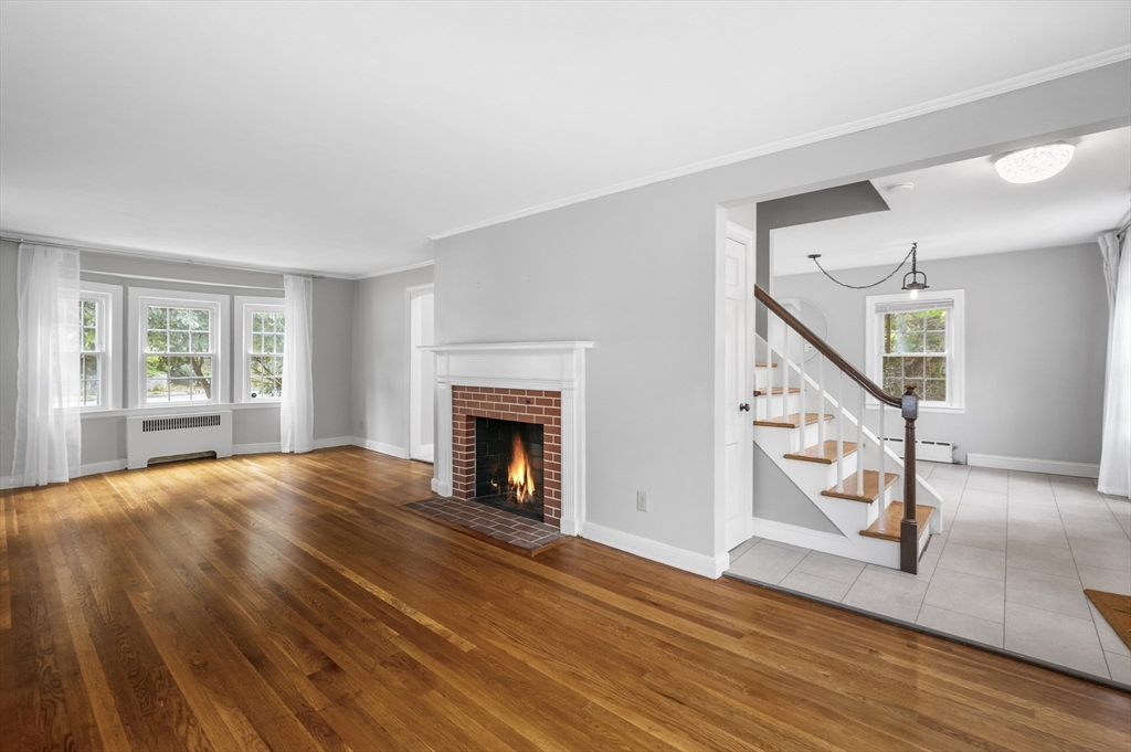 36 Melrose Street Worcester, MA 01605 - Photo 8 of 32 a view of an empty room with wooden floor fireplace and a window
