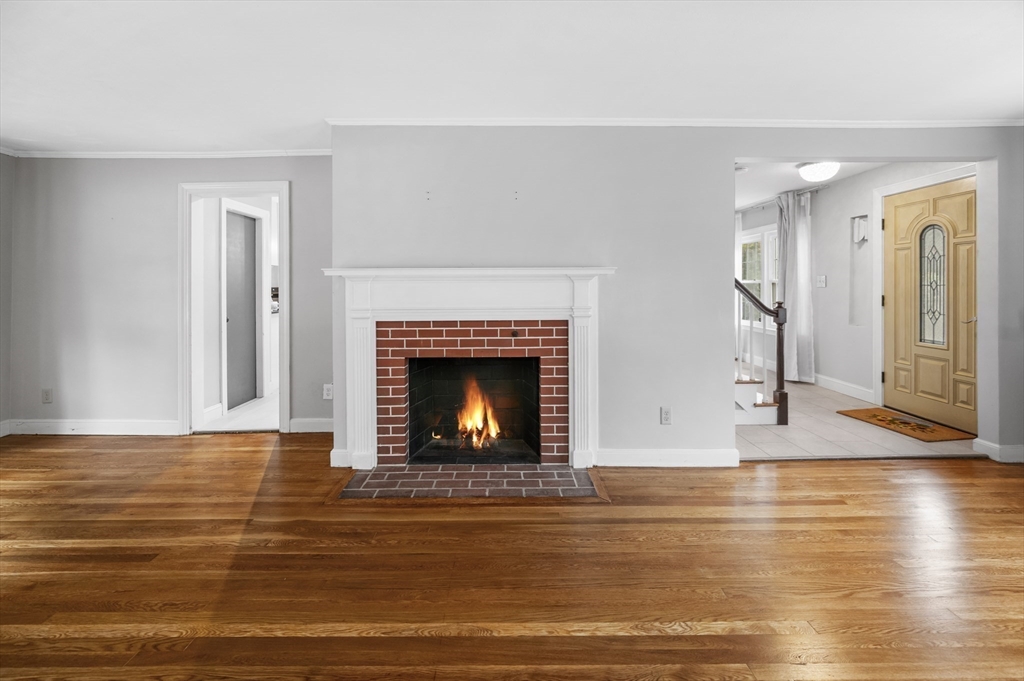 36 Melrose Street Worcester, MA 01605 - Photo 9 of 32 a view of empty room with wooden floor and fireplace