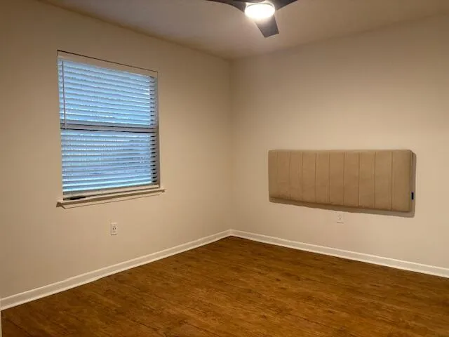 an empty room with closet and a bathroom
