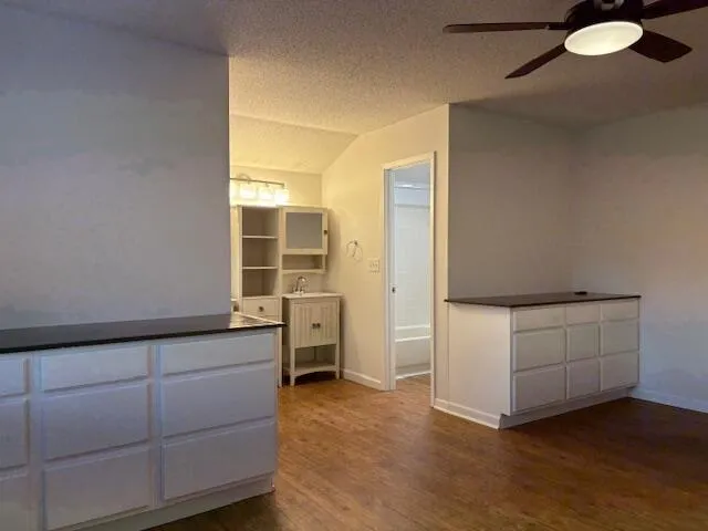 a white bath tub sitting next to a toilet