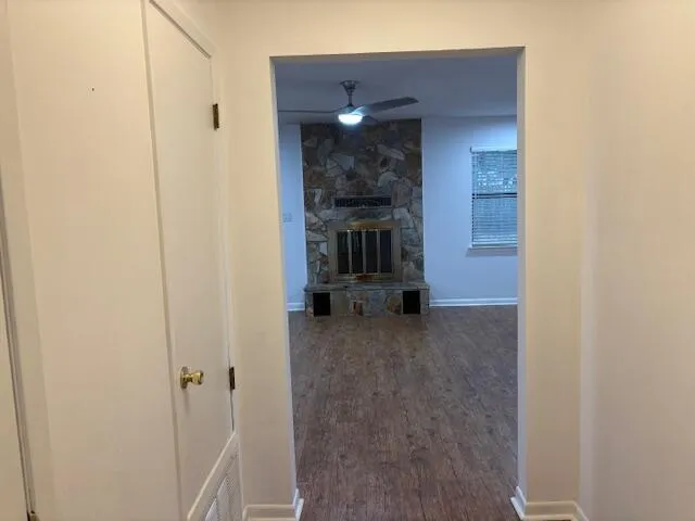 an empty room with windows and closet