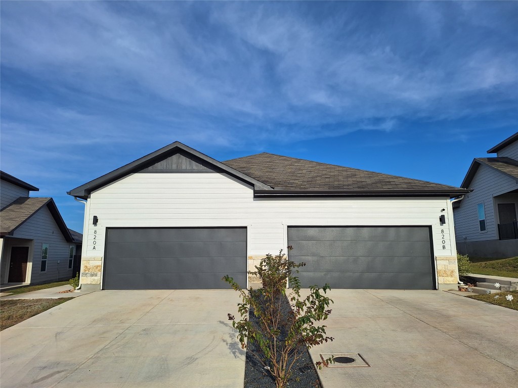 a front view of a house with a garage