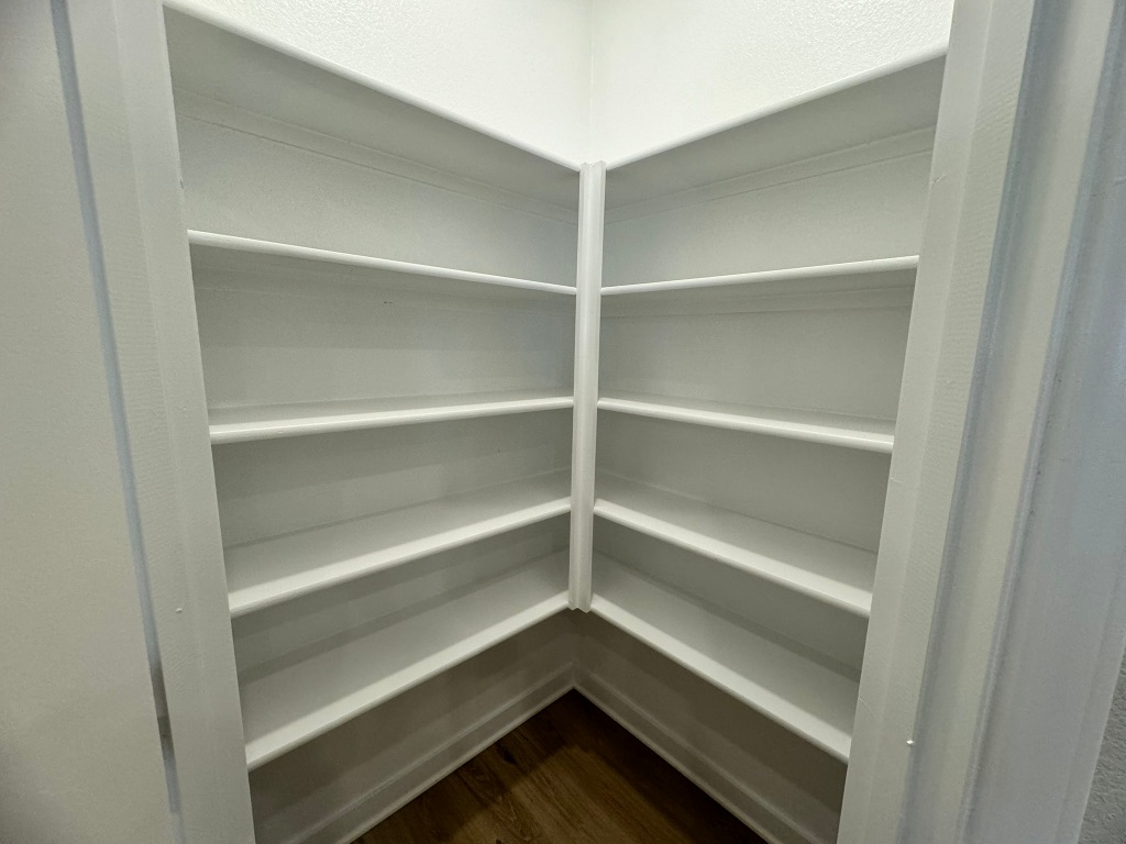 820 Staglin Street, Unit A Buda, TX 78610 - Photo 14 of 28 a view of walk in closet with empty racks
