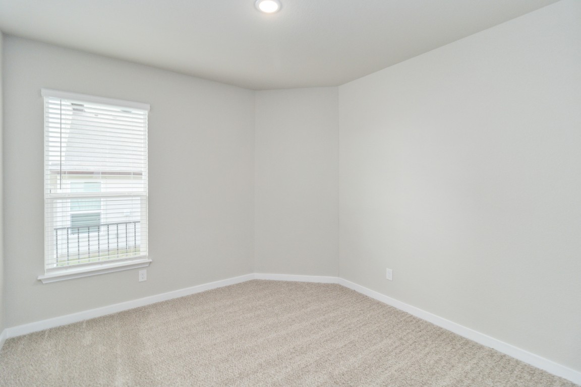 820 Staglin Street, Unit A Buda, TX 78610 - Photo 21 of 28 an empty room with a window