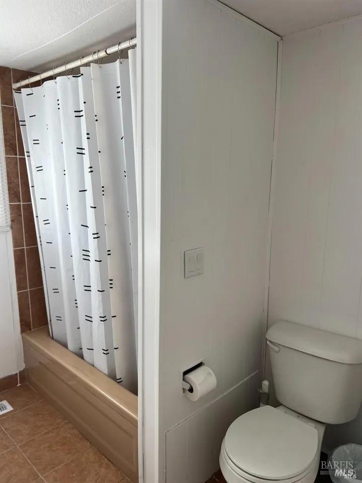 316 Pear Lane Santa Rosa, CA 95407 - Photo 12 of 17 a white toilet sitting next to a bathroom sink