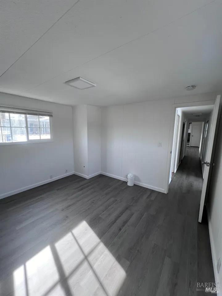 316 Pear Lane Santa Rosa, CA 95407 - Photo 13 of 17 wooden floor in an empty room with a window