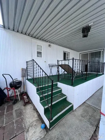 a view of stairs and patio