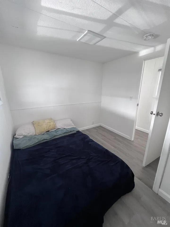 316 Pear Lane Santa Rosa, CA 95407 - Photo 8 of 17 a bedroom with a bed and a night stand