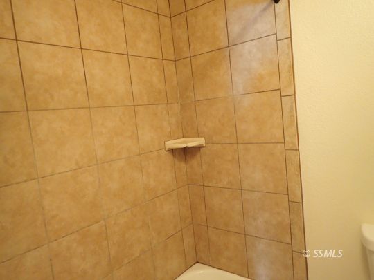 714 North Sanders Street Ridgecrest, CA 93555 - Photo 15 of 15 a bathroom with a shower