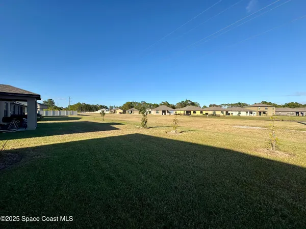 a view of a lake with houses in the back