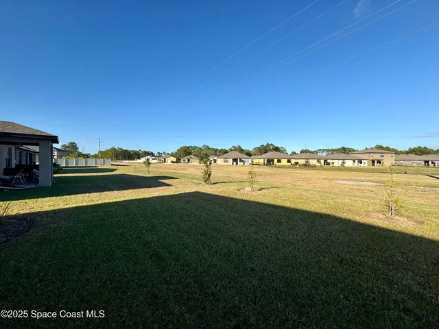 a view of a lake with houses in the back