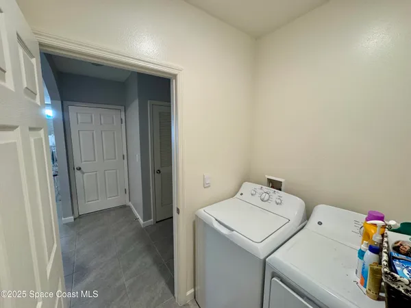 a utility room with dryer and washer