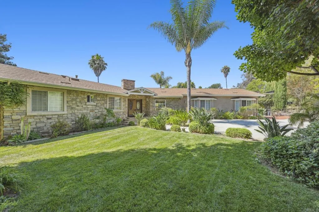 31619 Vía Puerta Del Sol Bonsall, CA 92003 - Photo 16 of 70 a front view of a house with a yard