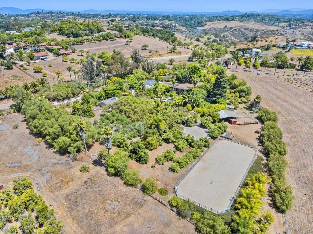 31619 Vía Puerta Del Sol Bonsall, CA 92003 - Photo 35 of 70 an aerial view of a houses with a yard