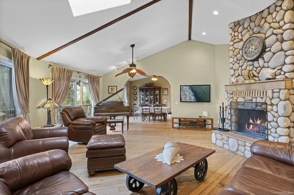 31619 Vía Puerta Del Sol Bonsall, CA 92003 - Photo 36 of 70 a living room with furniture and a fireplace