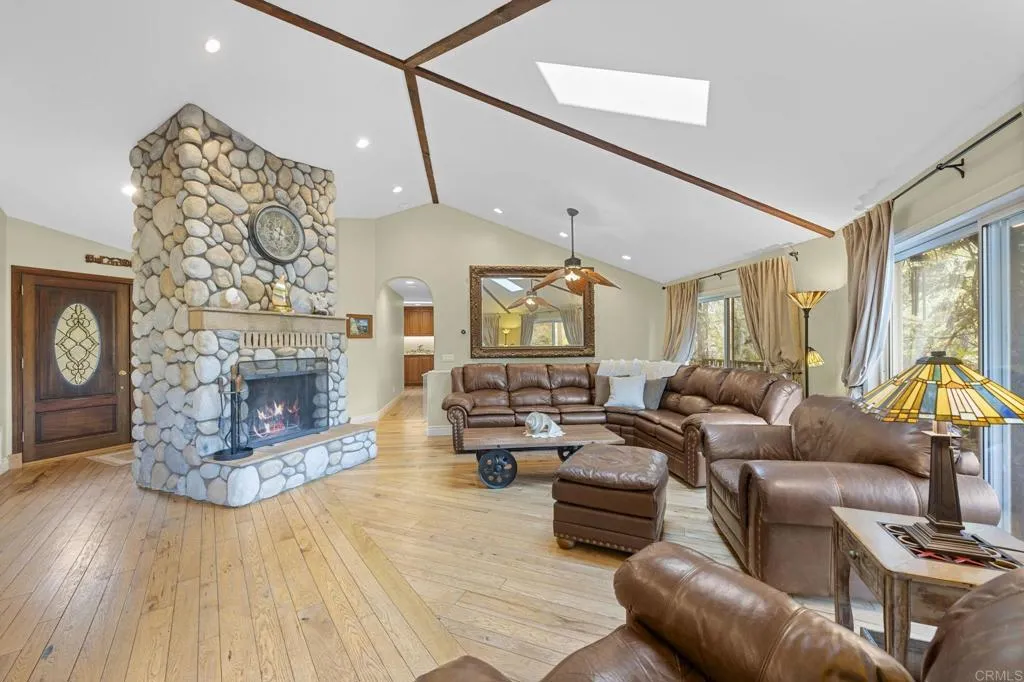 31619 Vía Puerta Del Sol Bonsall, CA 92003 - Photo 37 of 70 a living room with fireplace furniture and a fireplace