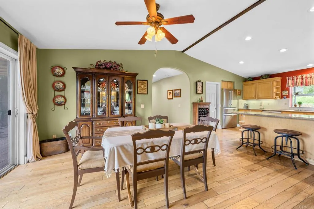 31619 Vía Puerta Del Sol Bonsall, CA 92003 - Photo 38 of 70 a dining room with furniture and wooden floor