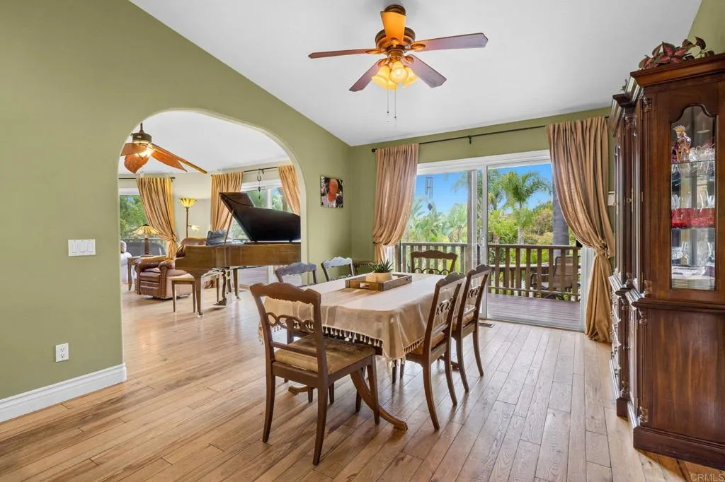 31619 Vía Puerta Del Sol Bonsall, CA 92003 - Photo 40 of 70 a view of a dining room with furniture window and wooden floor