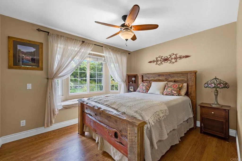 31619 Vía Puerta Del Sol Bonsall, CA 92003 - Photo 47 of 70 a bed room with a bed and a window