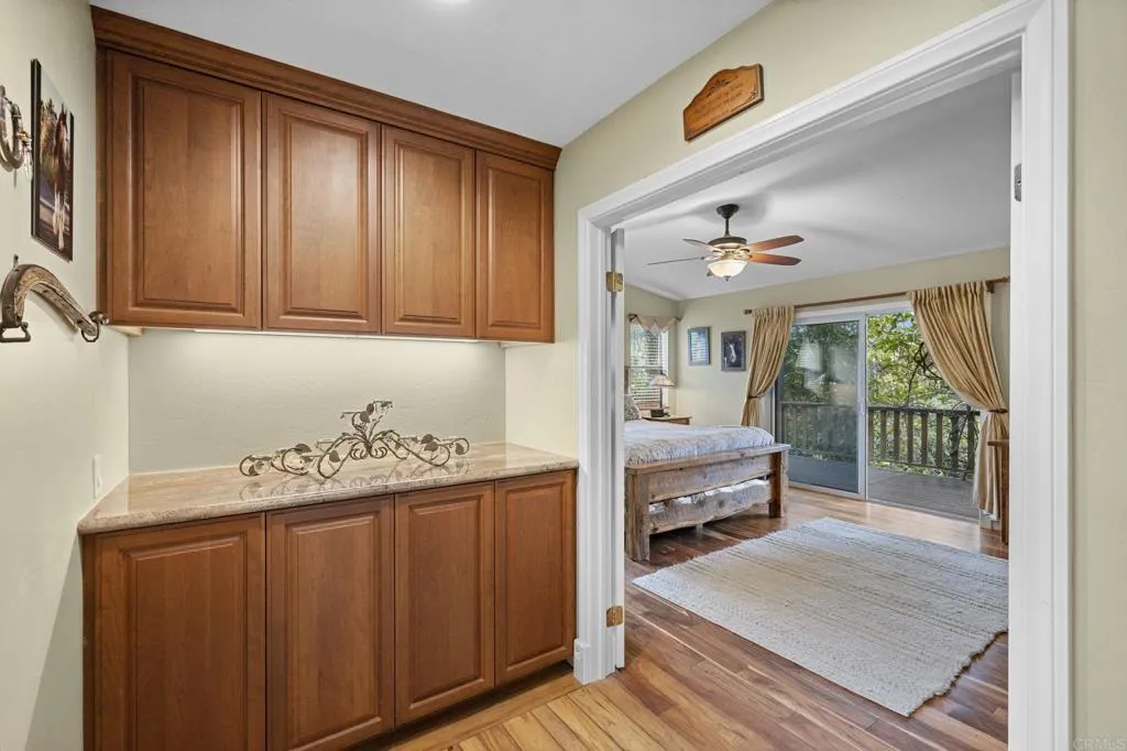 31619 Vía Puerta Del Sol Bonsall, CA 92003 - Photo 51 of 70 a bedroom with a bed and a mirror