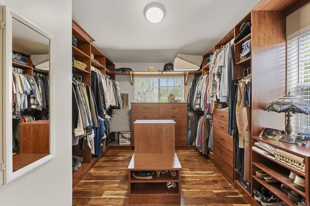 31619 Vía Puerta Del Sol Bonsall, CA 92003 - Photo 55 of 70 a view of a entryway with wooden floor and stairs