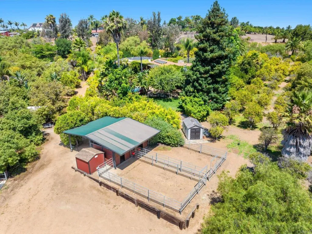 31619 Vía Puerta Del Sol Bonsall, CA 92003 - Photo 6 of 70 an aerial view of a house with a yard