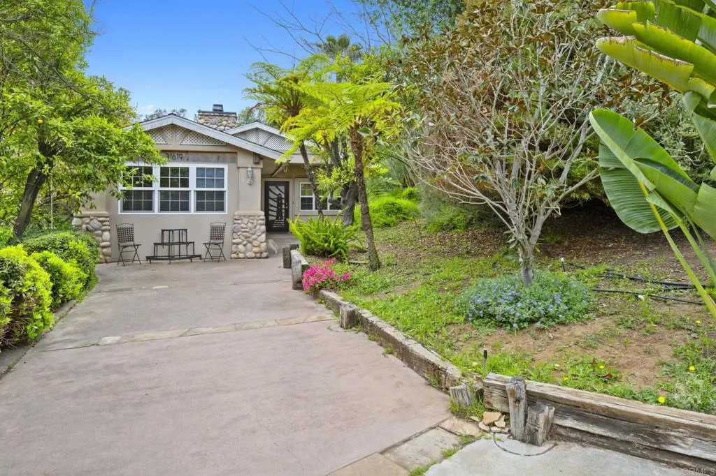 31619 Vía Puerta Del Sol Bonsall, CA 92003 - Photo 62 of 70 a front view of a house with garden