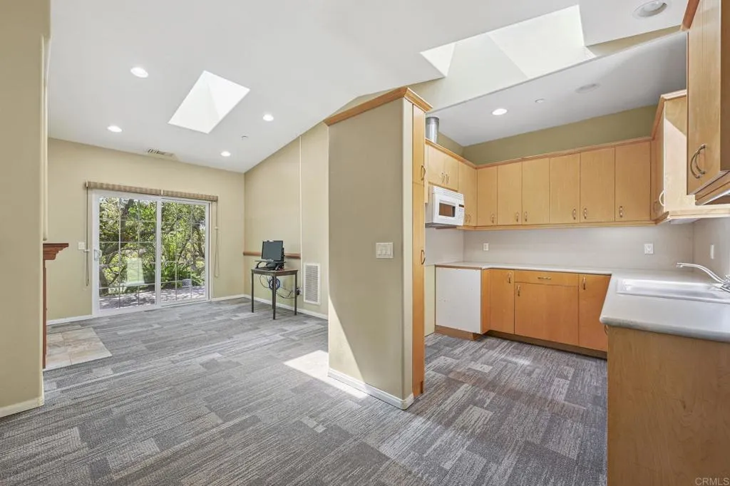 31619 Vía Puerta Del Sol Bonsall, CA 92003 - Photo 68 of 70 a view of empty room with wooden floor and a window