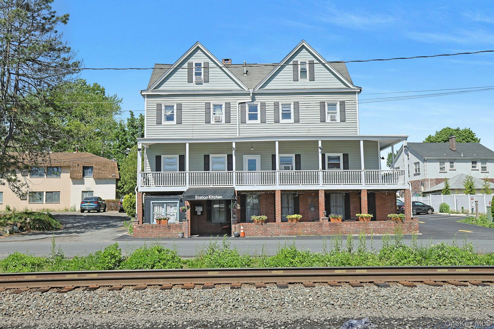 962 Rte 9W, Unit 106 Congers, NY 10920 - Photo 45 of 48 a view of large white house with large windows and a small yard