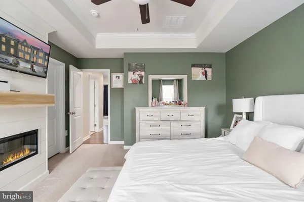 a bedroom with a bed and a fireplace