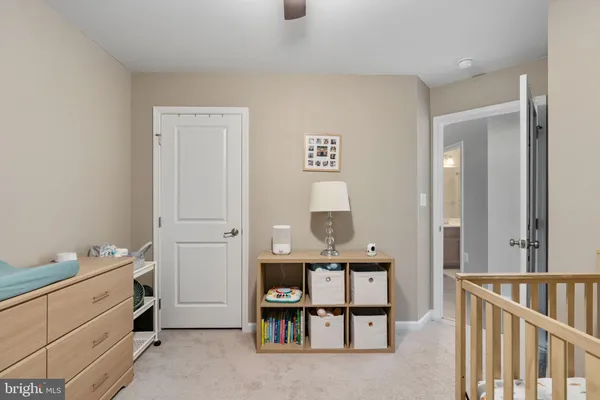 a view of a hallway to room with stair