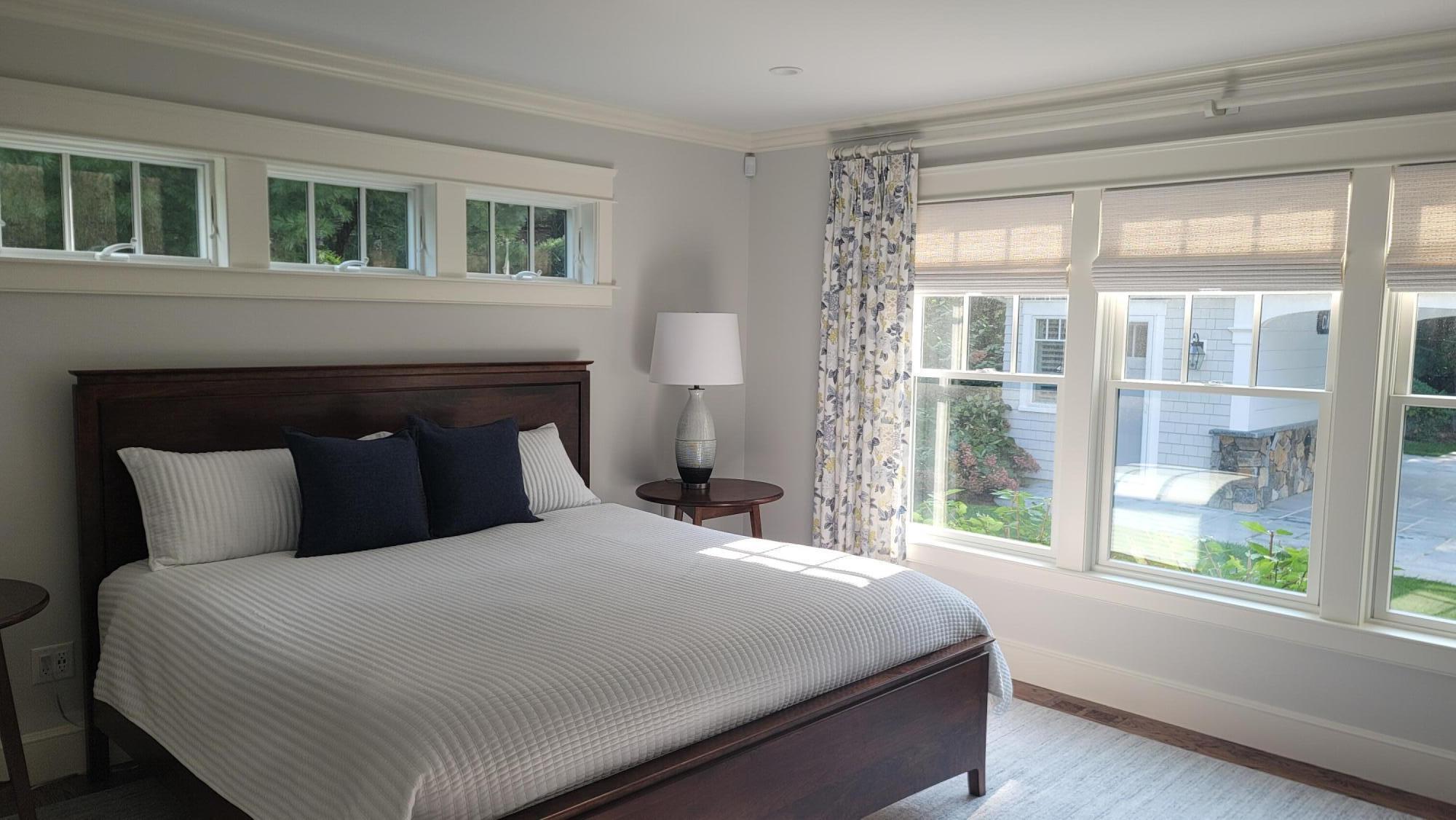 1045 Old Post Road Cotuit, MA 02635 - Photo 6 of 6 a bedroom with a large bed and a large window