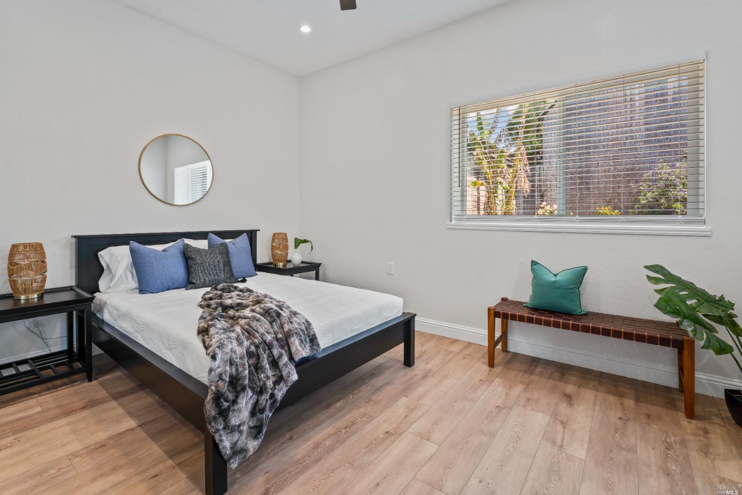 a bedroom with a bed and window