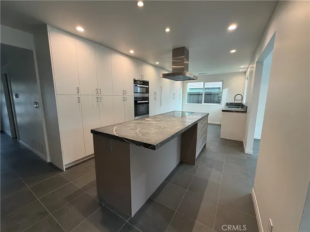 a bathroom with a sink a toilet and bathtub