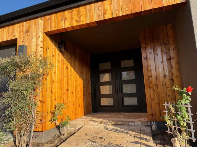a kitchen with a sink and a large window
