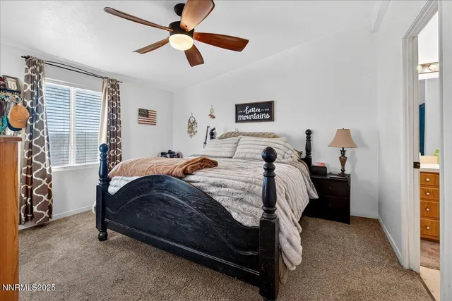a bathroom with a granite countertop sink a mirror and a shower