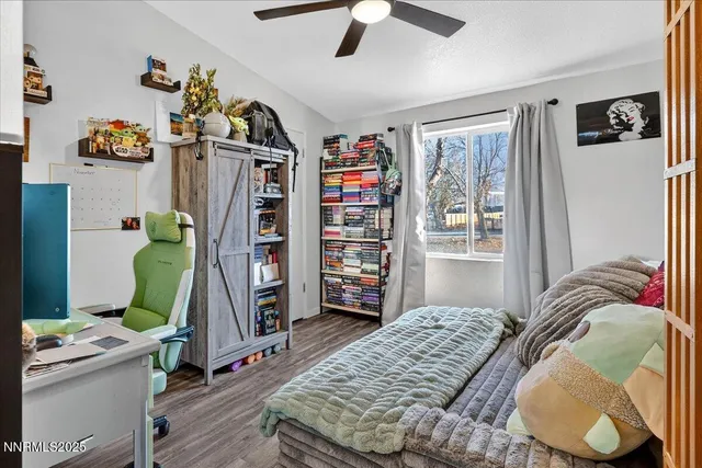 a lobby with a couch and potted plants