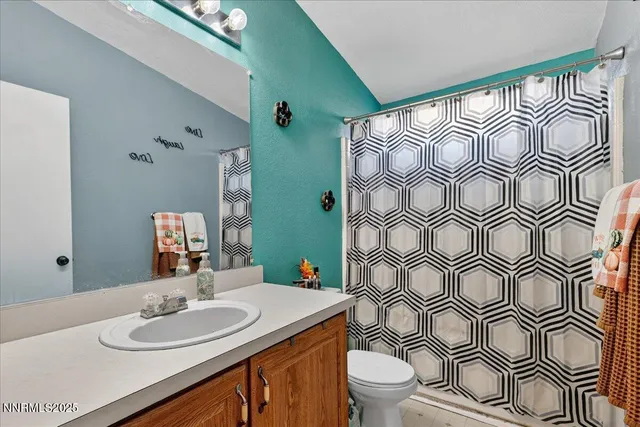 an outdoor sitting area with couch and wooden floors