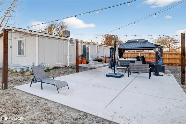 a view of yard with patio