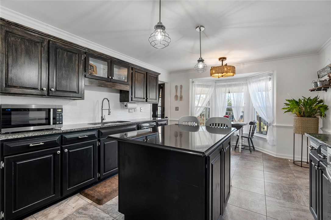 112 C-10-220 Anderson, SC 29621 - Photo 19 of 45 This kitchen features sleek countertops, stylish cabinetry, and ample space for culinary creations.