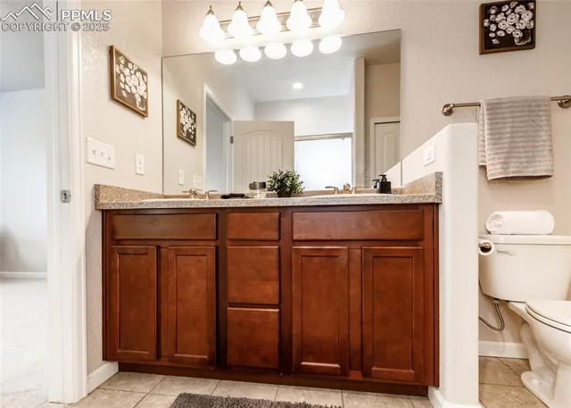 an aerial view of a house with a yard and lake view