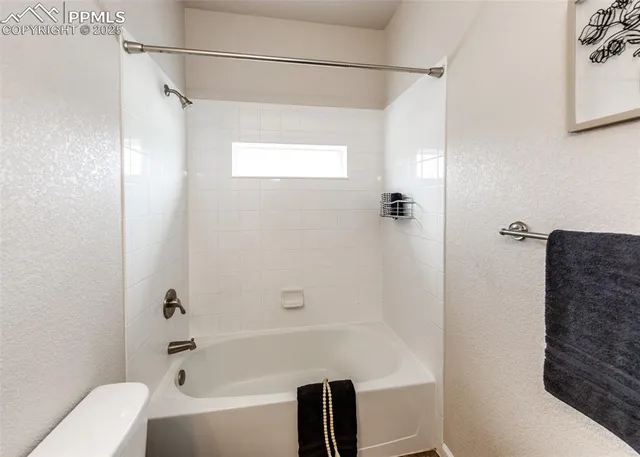 a kitchen with stainless steel appliances granite countertop a refrigerator sink and stove