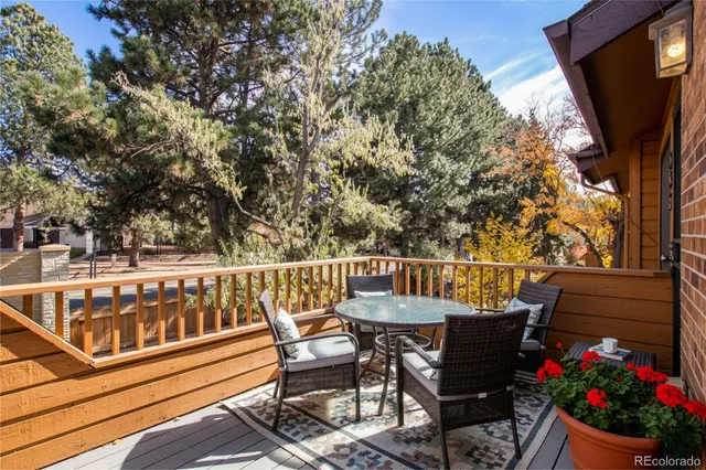 a view of a chairs and table in the balcony